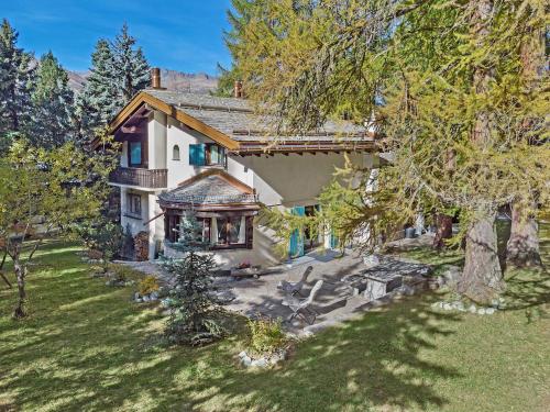 an aerial view of a house with a tree at Chesa Alvan - Surlej in Surlej