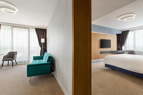 Postel nebo postele na pokoji v ubytování Ramada by Wyndham Slatina Parc
