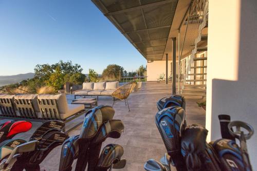 a row of shoes are lined up on a porch at AMORE RENTALS - Villa Ambretta in Campagnatico