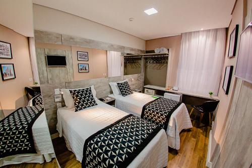 Katil atau katil-katil dalam bilik di Bristol Viçosa Hotel