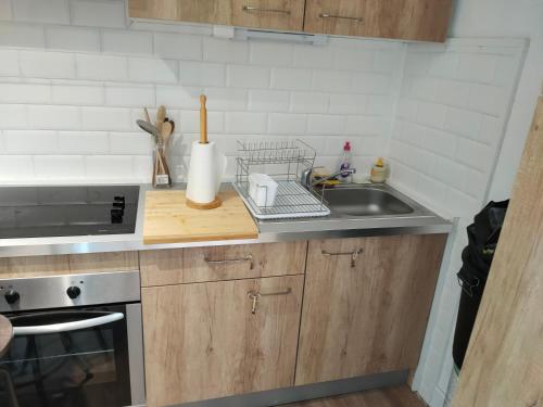 a kitchen with a sink and a counter top at LE QUAI in Port-la-Nouvelle