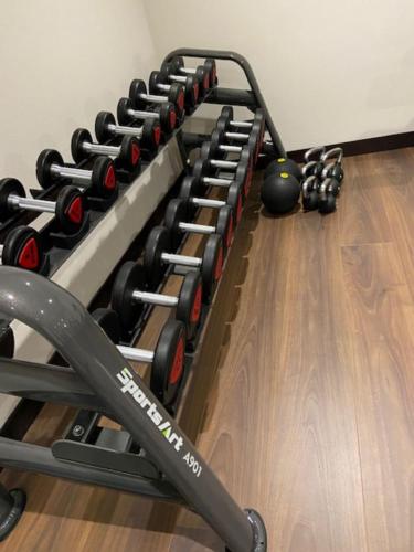 a row of dumbbells in a gym at Quentin XL Potsdamer Platz in Berlin