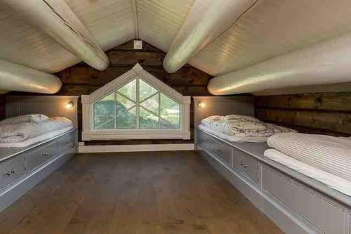 En eller flere senger på et rom på Stor og eksklusiv tømmerhytte Hemsedal
