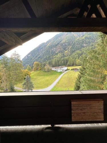 a view of a mountain from a window at Ferienwohnungen Ötztal in Sautens