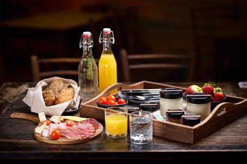 a table topped with a tray of food and drinks at Guesthouse S in Luče