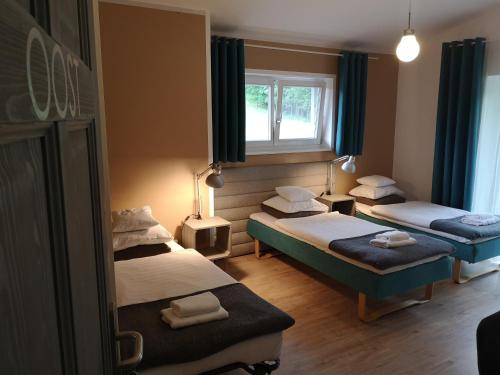 מיטה או מיטות בחדר ב-Orańska