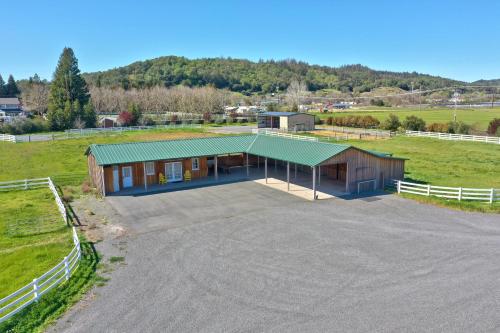 an overhead view of a large building with a green roof at Sanctuary On Lytton A Wine Country Escape in Geyserville
