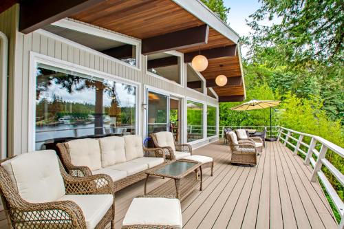 a porch with a couch and chairs and a table at St Claires Halo in Olympia
