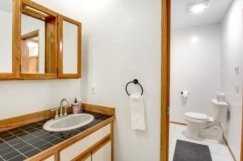 a bathroom with a sink and a toilet at St Claires Halo in Olympia