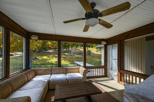 a porch with a couch and a ceiling fan at Casa De Lago in Mineral