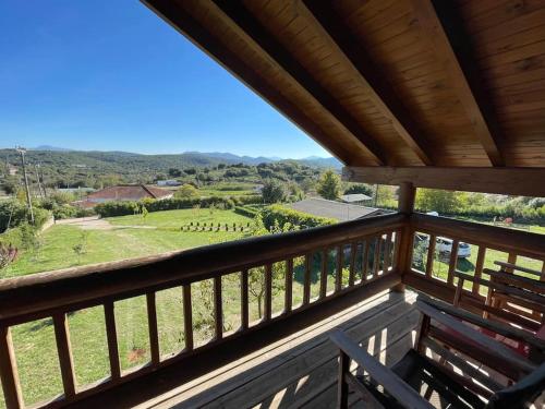 a view from the balcony of a cabin with a view at Chalet Klimatia - Όμορφη ξύλινη μεζονέτα με τζάκι in Klimatiá