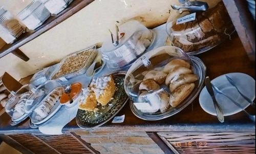 a table with a bunch of food on it at Pousada Flor de Lotus in Itacaré