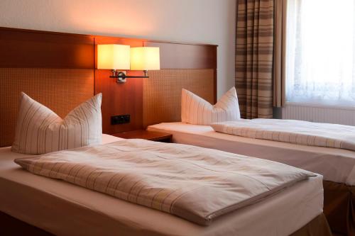 Voodi või voodid majutusasutuse Olympia Hotel Suhl toas