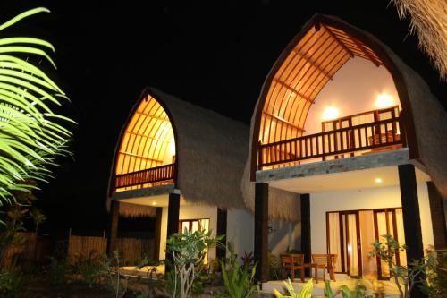 a villa with a view at night at Villa Rika in Gili Trawangan