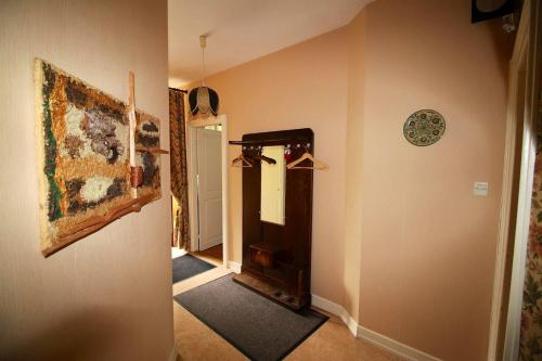 a hallway of a home with a mirror and a wall at Maison de charme avec jardin à Mitzach, vue sur montagne in Mitzach