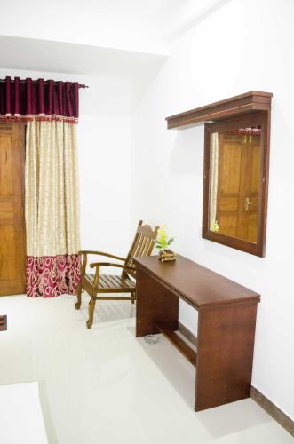 a living room with a desk and a chair at Suwa Arana Resort in Mirissa