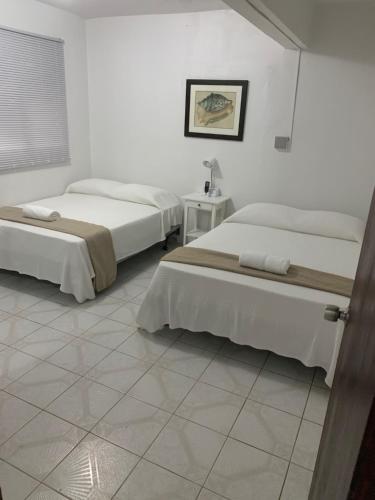 Letto o letti in una camera di CRAB ISLAND ADVENTURES APARTMENTS