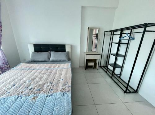 a bedroom with a bed and a mirror at Meritus Studio Holiday (Perai) in Perai