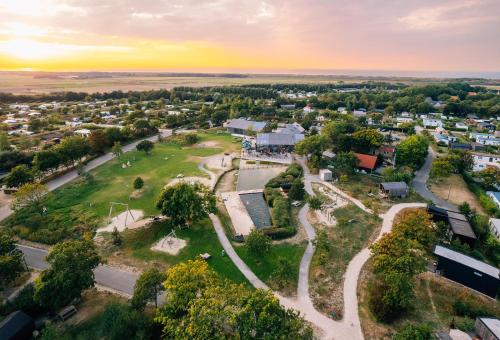 an aerial view of a small town with a park at Vakantiepark De Klepperstee in Ouddorp