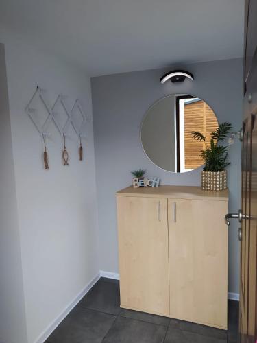 a kitchen with a counter and a mirror at Mieszkanie Reda in Reda