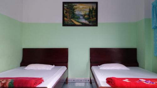 Postel nebo postele na pokoji v ubytování Minh Tai Hotel