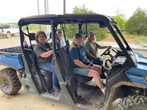 a group of people sitting in the back of a vehicle at Reflection Cabin on Lake Godstone in Jacksboro