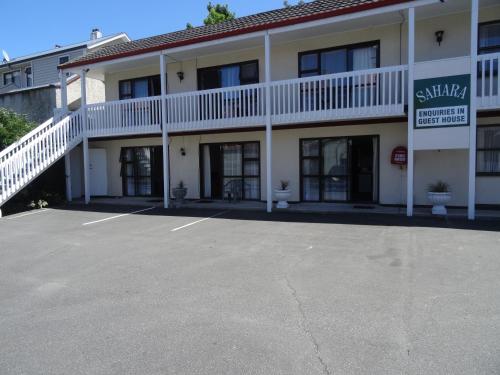 an empty parking lot in front of a hotel at Sahara Motels in Dunedin