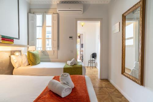 Posteľ alebo postele v izbe v ubytovaní Casa Gracia Apartments