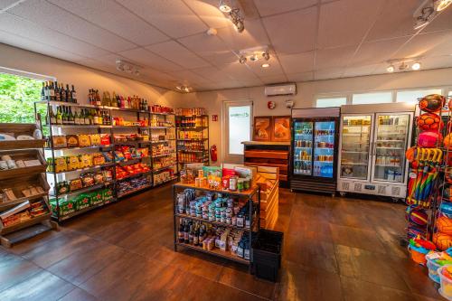 a store filled with lots of different types of goods at Comfort Rooms by EuroParcs De Hooge Veluwe in Arnhem
