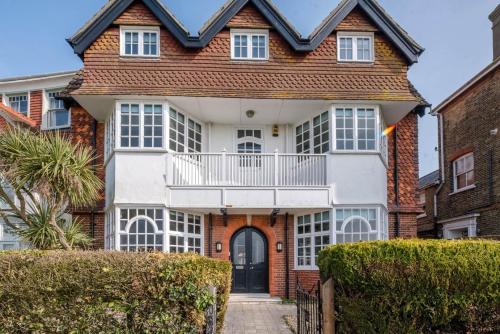 a large house with a balcony on top of it at The Links in Southwold in Southwold
