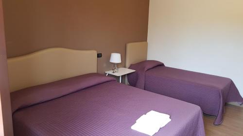 Postel nebo postele na pokoji v ubytování Il Casale degli Ulivi - Agriturismo - TENIMENTI LEONE
