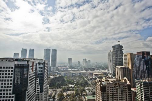 a view of a city with tall buildings at The Exchange Regency Residence Hotel Managed by HII in Manila