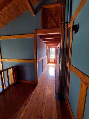 an overhead view of a hallway in a log cabin at Origenes Ecolodge de Montaña in El Bolsón