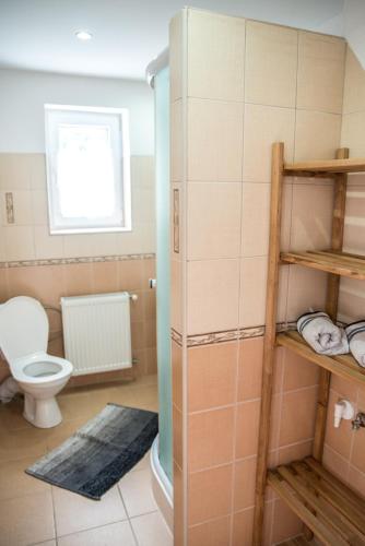 a bathroom with a toilet and a sink at Desa in Mýto pod Ďumbierom