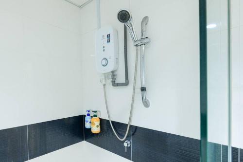 a shower in a bathroom with a shower head at 2R1B/Seaview Tropical /1~8Pax/Gurney Mansion One in George Town