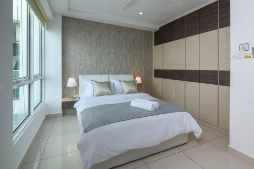 a bedroom with a large bed and a large window at 2R1B/Seaview Tropical /1~8Pax/Gurney Mansion One in George Town