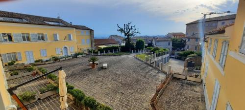an empty street in a town with buildings at appartamento in contesto esclusivo in pieno centro in Camerano