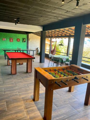 a room with two ping pong tables in it at Pousada Vale das Flores in Nova Friburgo