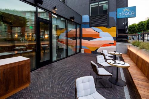 a restaurant with a mural on the side of a building at Kimpton Alton Fisherman's Wharf by IHG in San Francisco