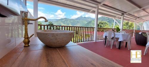 a room with a table and chairs on a balcony at HOTEL BOUTIQUE SIMACOTA in Simacota