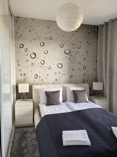 Posteľ alebo postele v izbe v ubytovaní Apartament Winnica