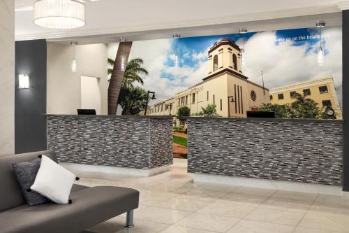 a building with a mural of a church at La Quinta by Wyndham Brownsville North in Brownsville