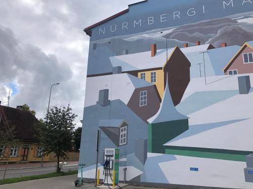 a mural on the side of a building at Nurmbergi Maja in Viljandi