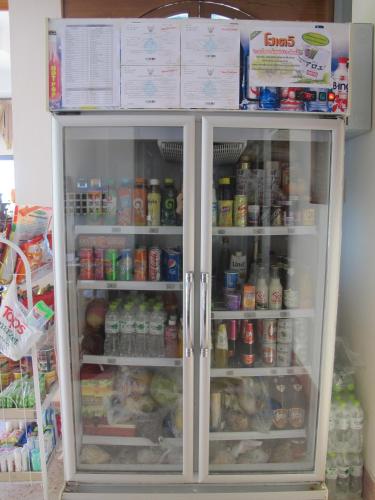 a refrigerator filled with lots of food and drinks at The Star Hotel in Udon Thani