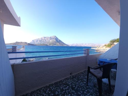 a balcony with a view of the ocean at Anna Studios in Myrties