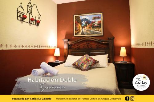 Säng eller sängar i ett rum på Posada de San Carlos La Calzada