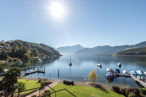 a view of a lake with boats in the water at Seehotel Sternen in Luzern