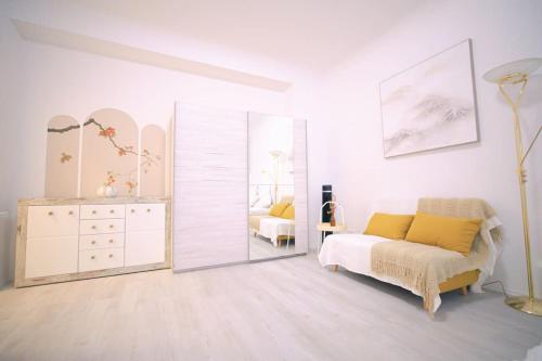 a bedroom with a mirror and a bed and a dresser at Room 4 Art Appartments Nr.2 in Wien Zentrum in Vienna