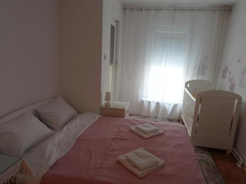 Ένα ή περισσότερα κρεβάτια σε δωμάτιο στο GO 2 Apartment
