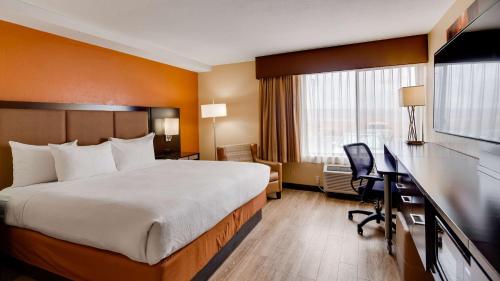 a hotel room with a bed and a desk at Best Western View of Lake Powell Hotel in Page